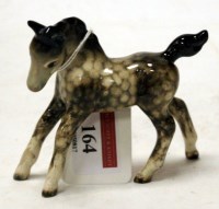 Lot 164 - A Beswick figure of a foal (small, gamboling...