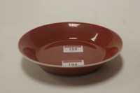 Lot 180 - A Chinese copper red porcelain saucer-dish, in...