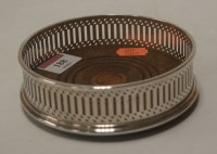 Lot 188 - A modern silver bottle coaster, of pierced...