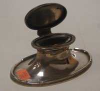 Lot 198 - A George V silver capstan inkwell, of oval...