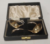 Lot 217 - A modern cased silver sifting spoon and...