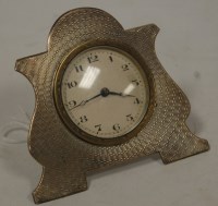 Lot 249 - An Edwardian silver cased travel clock, having...