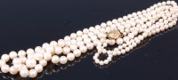 Lot 305 - A cultured pearl double string necklace with...