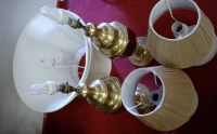 Lot 46 - A pair of large turned brass table lamps with...