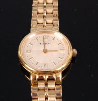 Lot 313 - A Tissot steel cased ladies bracelet watch,...