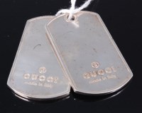 Lot 320 - A pair of Gucci silver dog tags