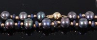 Lot 324 - A Tahitian grey pearl necklace, having 14ct...