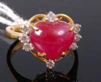 Lot 337 - A yellow metal, heart shaped ruby and white...