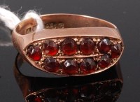 Lot 343 - A 9ct gold and garnet set ring, size N+