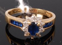 Lot 345 - An 18ct gold, sapphire and diamond flower head...