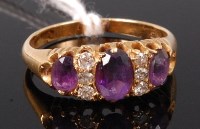 Lot 355 - An 18ct gold, amethyst and diamond set ring,...