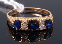 Lot 358 - A yellow metal, sapphire and diamond ring, the...