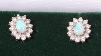 Lot 369 - A pair of 18ct white gold, cabochon opal and...