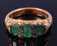 Lot 372 - A ladies yellow metal, emerald and diamond...