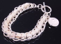 Lot 395 - A Tiffany & Co ladies silver curb and mesh...