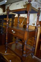 Lot 1419 - A Victorian walnut three-tier whatnot having...