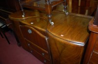 Lot 1420 - A 1950s figured walnut sideboard by Beautility