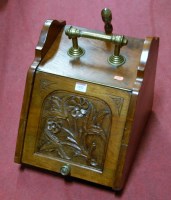 Lot 1422 - An Edwardian walnut coal purdonium with shovel