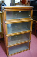 Lot 1428 - A 1930s Globe Wernicke & Co. walnut four tier...