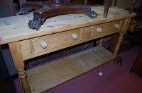 Lot 1434 - A modern pine two drawer two-tier side table,...