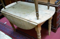 Lot 1185 - A reclaimed pine drop leaf kitchen table...
