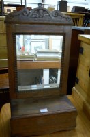 Lot 1191 - An oak hanging bathroom mirror having hinged...
