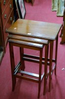 Lot 1197 - A walnut nest of three occasional tables