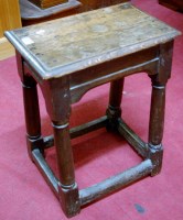Lot 1206 - An antique joined oak joint stool