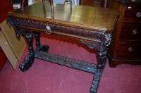 Lot 1207 - A circa 1900 heavily carved oak single drawer...