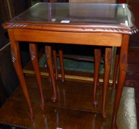 Lot 1222 - A reproduction mahogany nest of three...