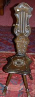Lot 1225 - A low relief carved oak and beech spinning seat