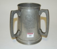Lot 181 - A George V pewter tyg, having presentation...