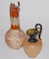 Lot 191 - A Royal Doulton stoneware ewer on a mottled...