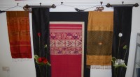 Lot 227 - A collection of silk embroidered wall hangings;...