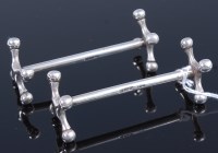 Lot 318 - A pair of Mappin & Webb silver cutlery rests, 8cm
