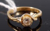 Lot 319 - An 18ct gold diamond solitaire ring the...