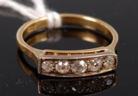 Lot 322 - An 18ct gold five stone ring, the graduated...