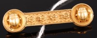 Lot 325 - A late 19th century yellow metal bar brooch...