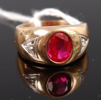 Lot 329 - A 10ct gold ruby and diamond set ring, the...