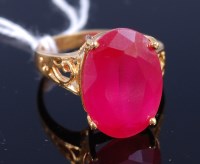 Lot 333 - A gilt metal and red hardstone set dress ring