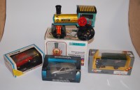 Lot 375 - A boxed clockwork road-roller; together with a...