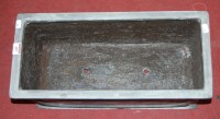Lot 402 - A faux lead planter of rectangular form