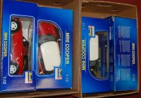 Lot 406 - Four boxed Revell 1.12 scale model Mini Coopers