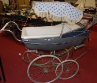 Lot 425 - A mid 20th century perambulator having grey...