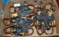 Lot 473 - A set of six cast iron fleur de lys and copper...