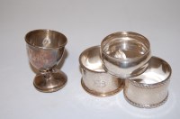 Lot 251 - Three various early 20th century silver napkin...