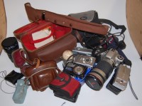 Lot 379 - A box of assorted cameras and accessories to...
