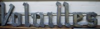 Lot 1064 - A French forged metal sign 'Valaille', w.133cm