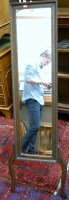 Lot 1070 - A moulded oak framed easel three quarter...