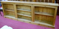 Lot 1096 - A large modern low pine freestanding open...
